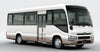 White group shuttle safari transfer bus with a visible Toyota logo on a gray background