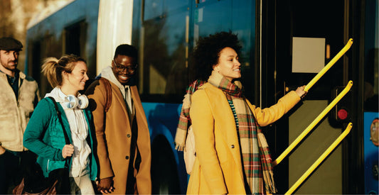 People boarding a bus on a cold day