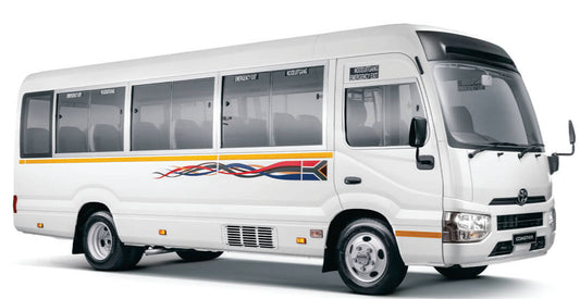 White Toyota Coaster Bus for Rental in Nairobi, Kenya, with a red and blue logo on a white background